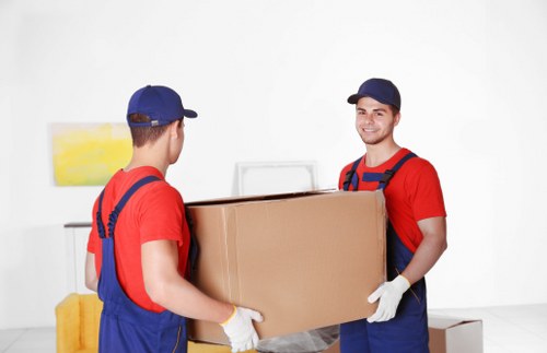 Team member preparing items with protective moving equipment