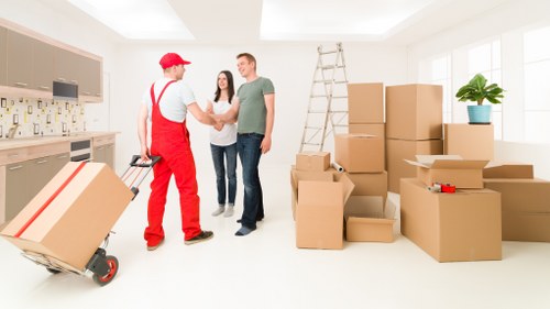 Loading household boxes and furniture into a van in Waterloo